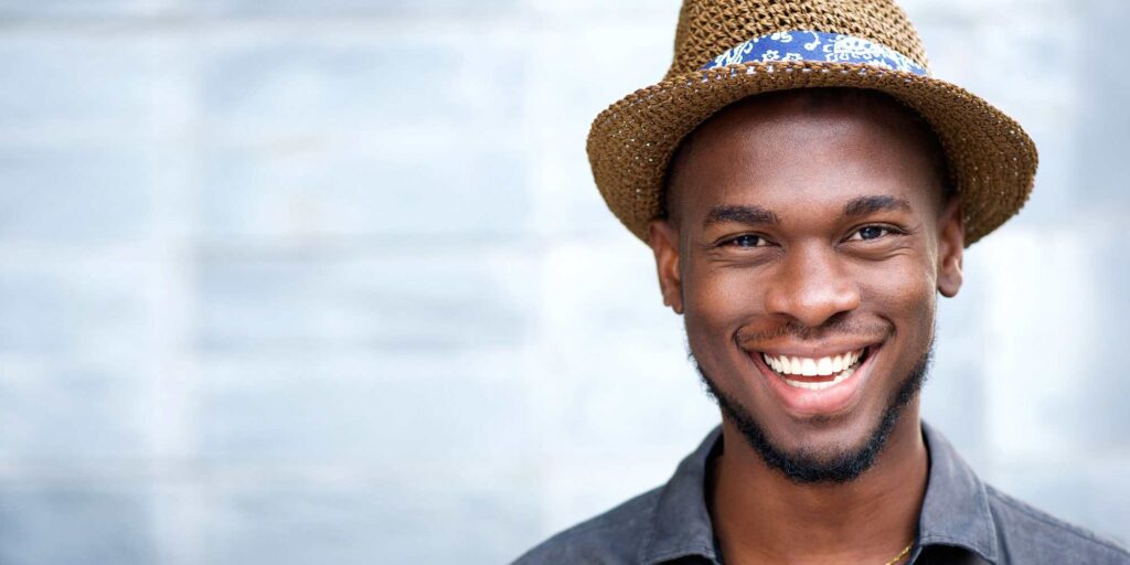 dental patient smiling after crown lengthening procedure 2